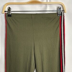 Eye Candy dark olive leggings with silver, black and red side stripes: